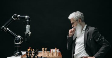 Man playing chess with automaton